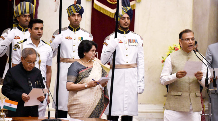President Pranab Mukherjee administers oath to new Minister of State Jayant Sinha at the swearing-in ceremony at Rashtrapati Bhavan in New Delhi on Sunday. (Source: PTI)