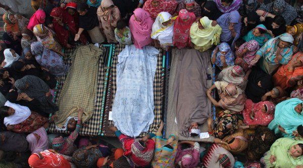 At least 61 people including, 10 women, eight children and three security personnel were killed on Sunday. (Source: AP photo)