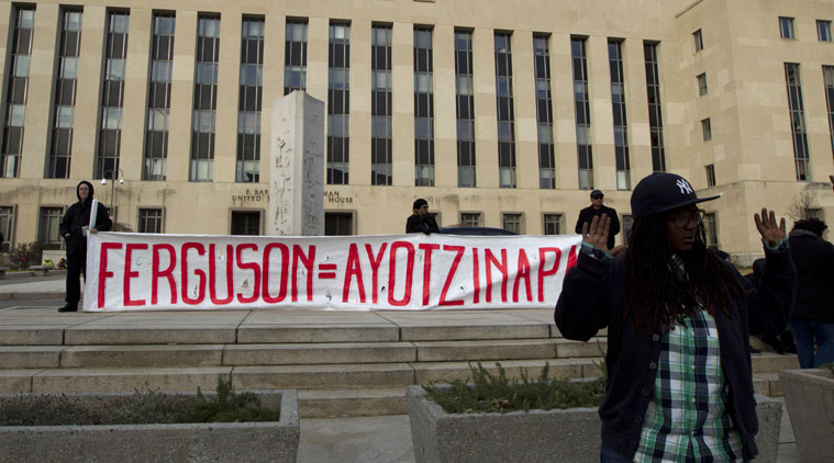 Equilla McCray gestures in front of the E. Barrett Prettyman US Courthouse in Washington, on Saturday during the Justice for All rally. (Source: AP photo)