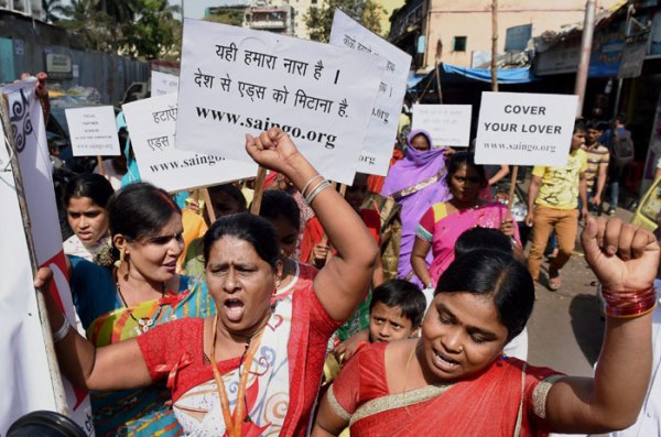 4.Sex workers from Kamathipura participate in a rally to spread awareness on AIDS on World AIDS Day in Mumbai on Monday.  (Source: PTI Photo)