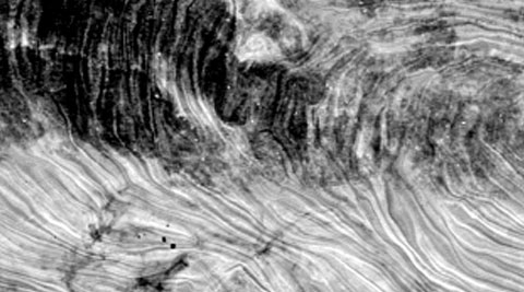 A map of a patch of sky showing the temperature and polarisation of cosmic microwaves from the end of the Big Bang.