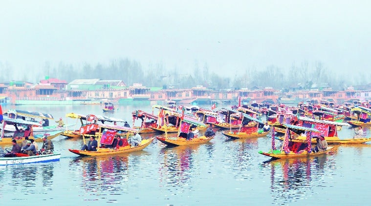 A shikara rally on the Dal Lake, taken out by BJP workers to welcome Modi. (Source: Express photo by Shuaib Masoodi)