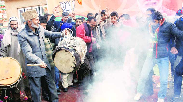 BJP workers celebrate in Srinagar on Wednesday. (Source: PTI)