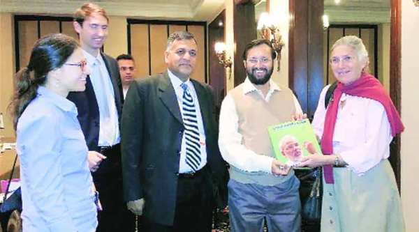 Prakash Javadekar presents Narendra Modi’s book on Climate Change to US delegates in Lima, Monday. (PTI)