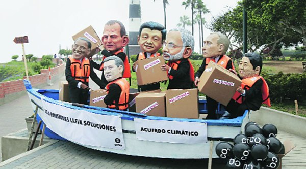 Activists wear masks of world leaders during a demonstration demanding cuts in global emission at the UN Climate Change Conference in Lima on Friday.