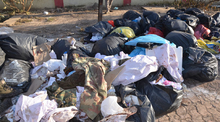 Uniforms of dead CRPF men found in garbage dump.