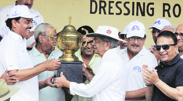Vasu Paranjpe and Vengsarkar pose with the trophy as Wadekar and Gavaskar look on. (Express photo)