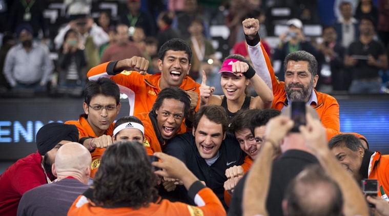 Roger Federer played three consecutive sets - mixed doubles, doubles and singles - in his debut appearance in Delhi (Source: AP)