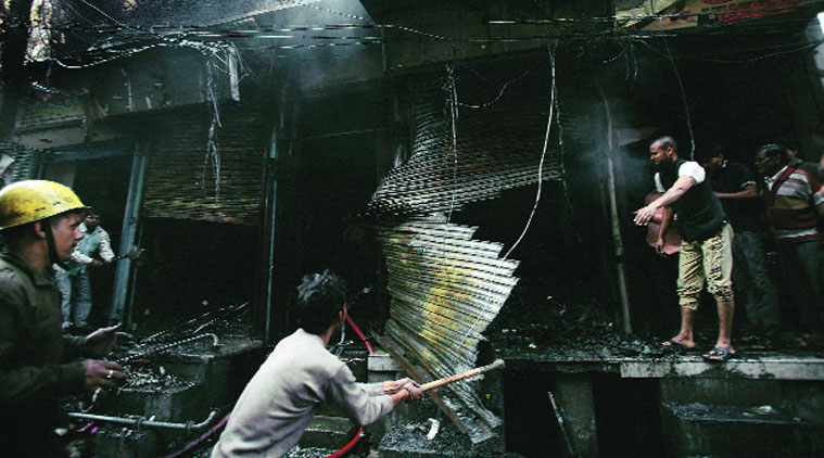 Gutted garment shops in Geeta Colony on Tuesday. (Source: Express photo by Praveem Khanna)