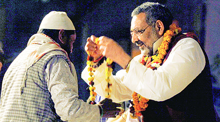Union Minister Giriraj Singh garlands a Muslim man during his rally in Seemapuri in Northeast Delhi on Tuesday. (Source: Express photo by Praveen Khanna)