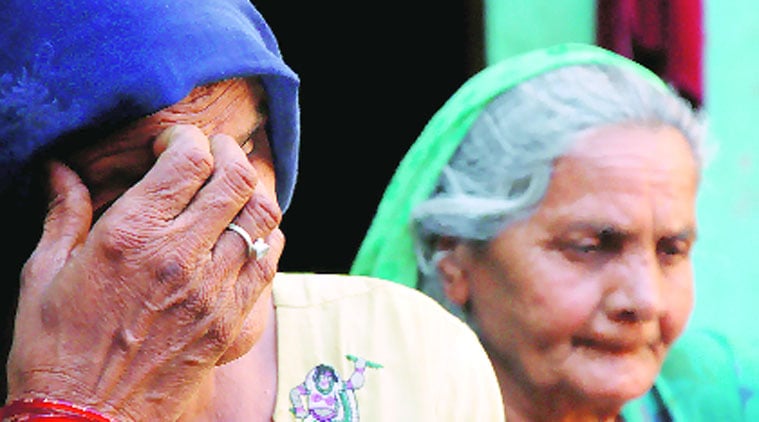 Family members of accused Kuldeep at their Aasan village residence on Monday. (Express photo by Gajendra Yadav)