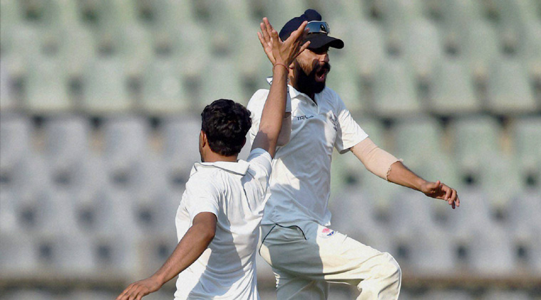 J&K players celebrate the wicket of Aditya Tare on Day 3 on their Ranji Trophy match against Mumbai. (Source: PTI file)