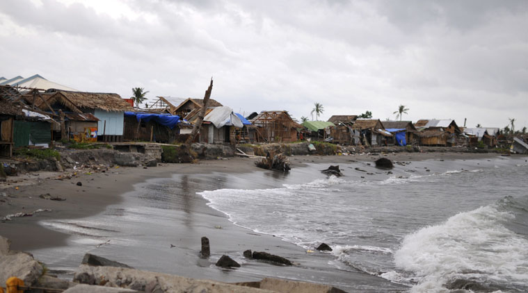 A coastal village in central Philippines, shows abandoned houses as residents take shelter at evacuation centers. (Source: AP photo)