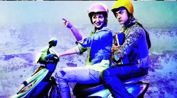 A bewildered Aamir Khan listens intently to  Anushka Sharma in PK