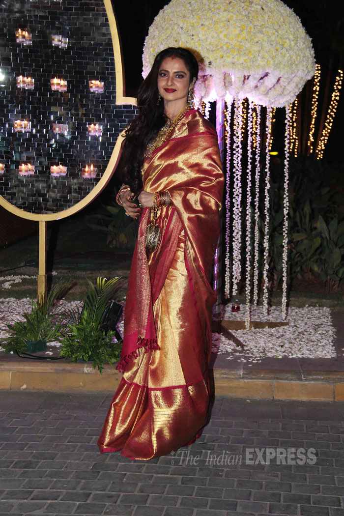 Veteran actress Rekha was a stunner in her signature Kanchipuram (kanjeevaram) sari with a deep lip-colour and side-swept hair. (Source: Varinder Chawla)