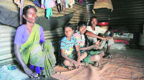 Urao with his wife and children. The shanty near AIIMS where they live gets no power from 8 am to 5 pm when he and his wife are meant to be at work