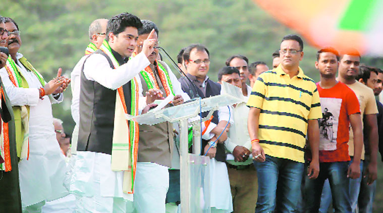 Sudip Sinha (yellow T-shirt), brother of BJP state president Rahul Sinha during a TMC rally at Shahid Minar on Monday. (Source: Express photo by Subham Dutta)