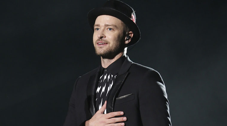 Justin Timberlake was overcome with emotion as he was presented with a gift by a young fan on stage over the weekend. (Source: Reuters)
