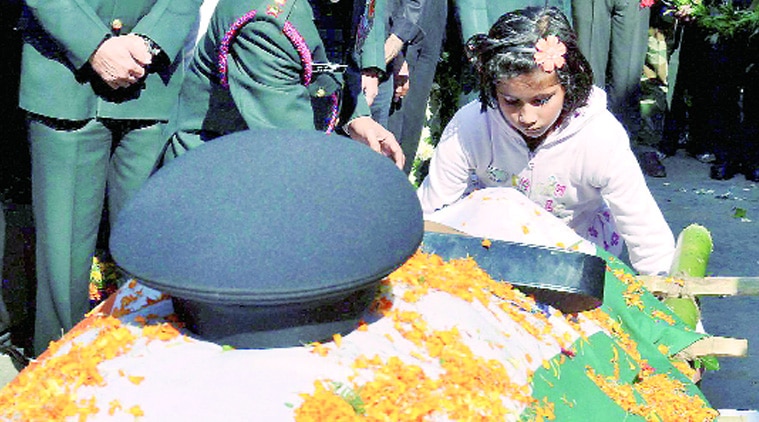 Daughter of Lt Colonel Sankalp Kumar pays tribute to him in Ranchi on Sunday. (Source: PTI photo)
