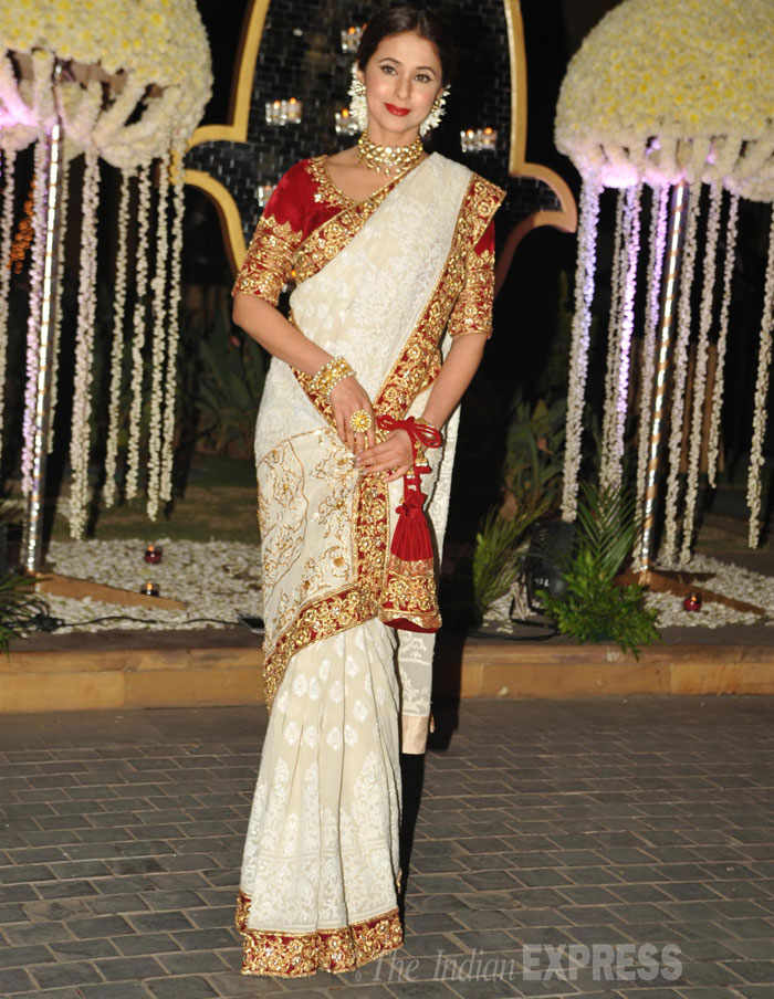Urmila Matondkar was all decked up in a red and white sari with gold jewellery and flowers in her hair. (Source: Varinder Chawla)