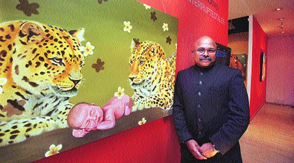 A child sleeps between cheetahs in his work Uninterrupted V