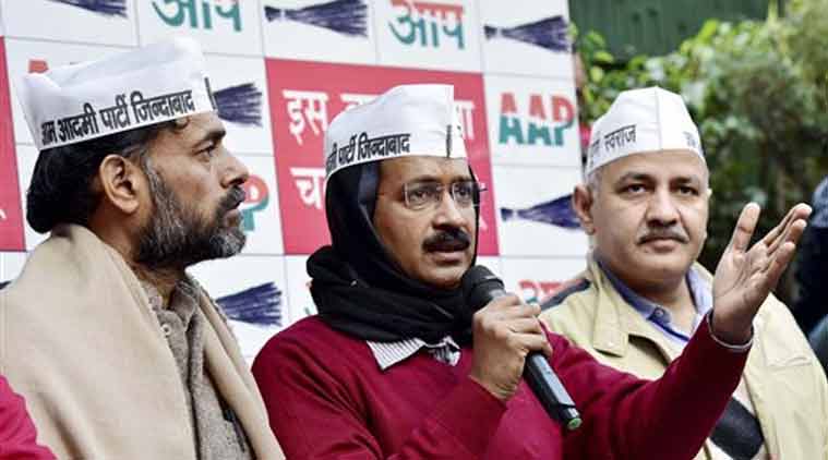 AAP chief Arvind Kejriwal with party leaders Manish Sisodia and Yogendra Yadav during a press conference in New Delhi on Saturday. (Source: PTI)