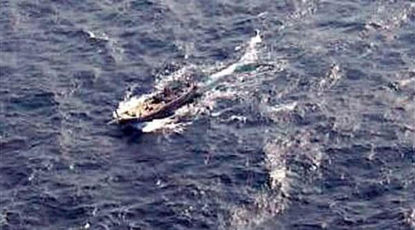 An aerial view of the fishing boat carrying explosives before being intercepted by Indian Coast Guard approximately 365 km off Porbander in Gujarat, on Wednesday. (PTI Photo)