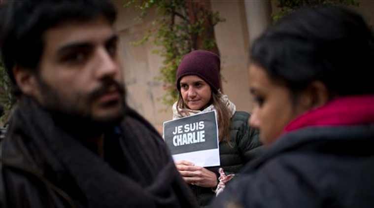 French journalists and their families show solidarity with the French satirical paper Charlie Hebdo at the French embassy in New Delhi (Source: AP)
