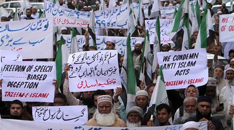 Supporters of a Pakistani religious party 'Tanzeem-e-Islami hold a demonstration to protest against caricatures published in French magazine Charlie Hebdo, in Karachi (Source: AP)