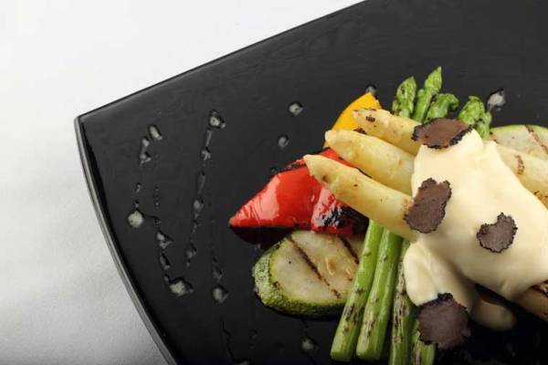 Pan grilled green asparagus, wood fired white asparagus, goat's cheese crumbles and black summer truffle