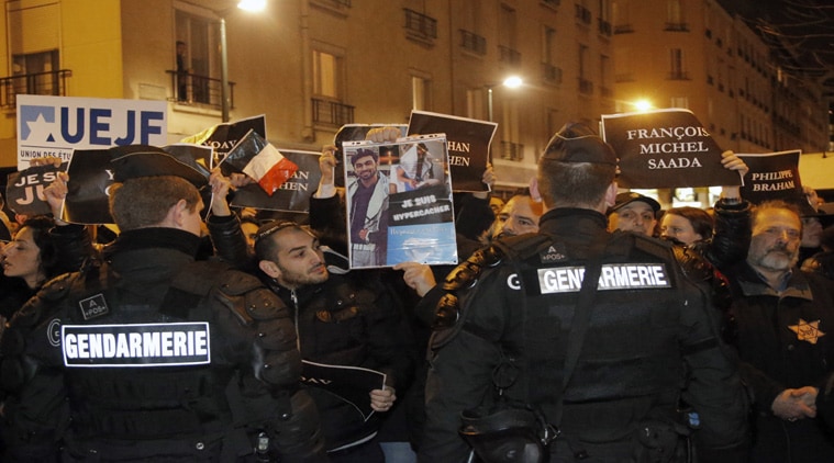 Members of the Union of French Jewish students hold posters with the first names of the victims during a demonstration outside a kosher grocery store where four hostages were killed. (Source: AP photo)