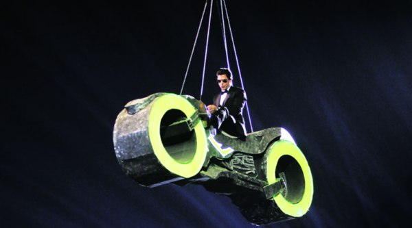 Shah Rukh Khan enters to take over as host on a futurustic bike
