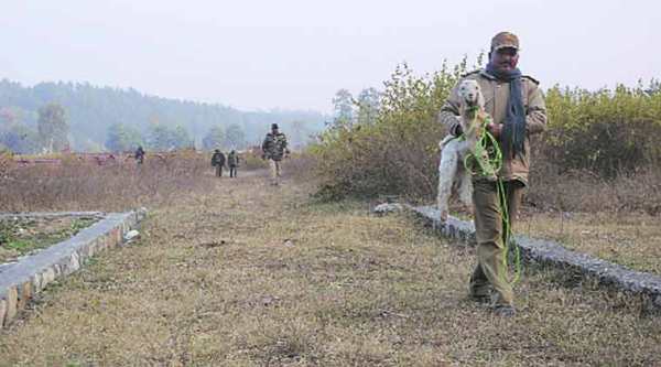 A forest official on way to tie a goat as a bait for the leopard in Dehradun. (Express Photo by: Virender Singh Negi)