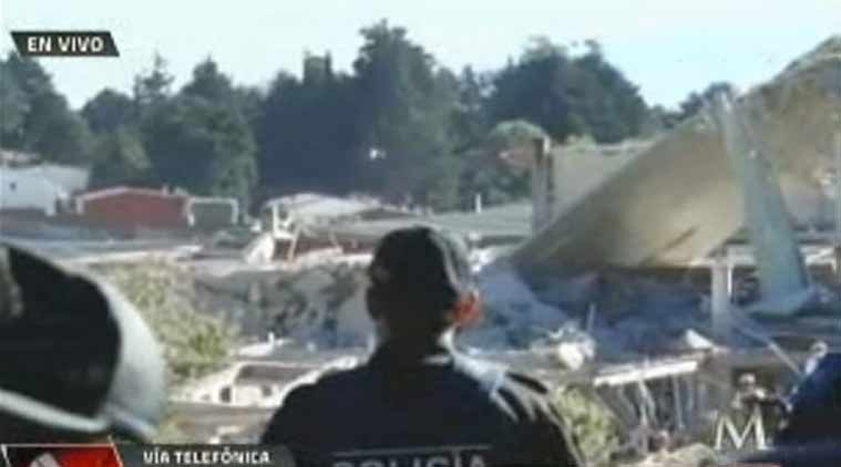 Television images showed people with bloodied faces being carried to ambulances. Around 40 percent of the hospital was destroyed. (Source: AP photo)