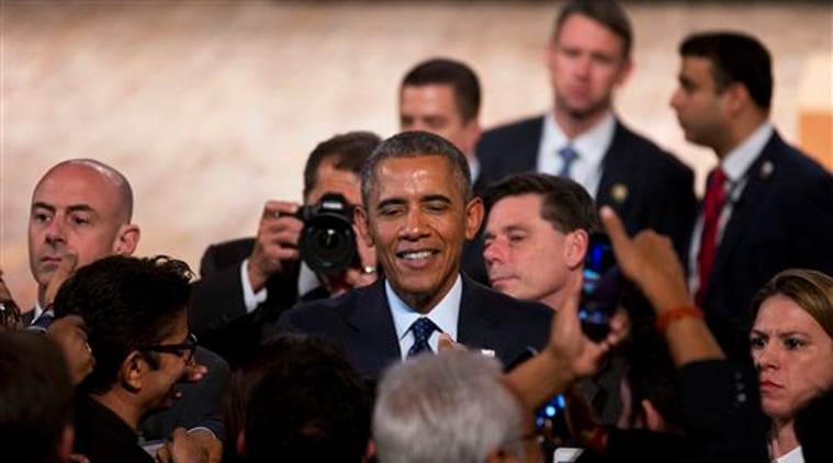 U.S. President Barack Obama interacts with the audience after delivering a speech at the Siri Fort Auditorium, a government-run event center, in New Delhi on Tuesday, Jan. 27, 2015. (AP Photo)