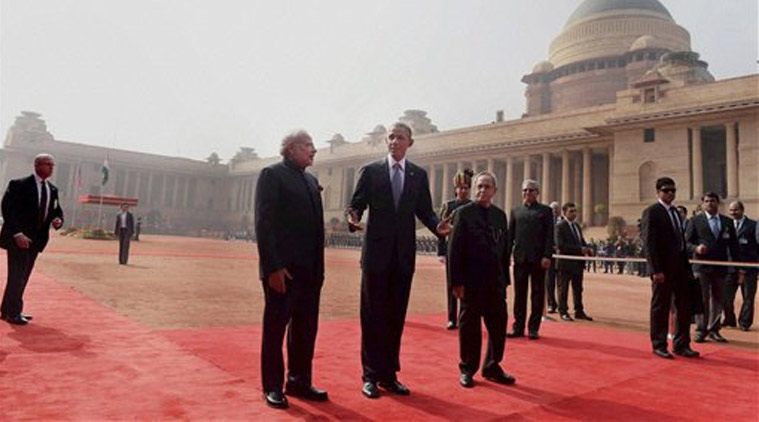 US President Barack Obama gestures as President Pranab Mukherjee and Prime Minister Narendra Modi look on during his ceremonial welcome at Rashtrapati Bhavan in New Delhi on Sunday. (Source: PTI)