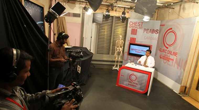 In this photo, Pakistani Dr. Nadeem Uddin Siddiqui answers a question from people, mainly women calling in from villages or remote areas, while being filmed for "Clinic Online" on private satellite channel HTV in Karachi, Pakistan. (Source: AP)