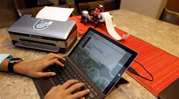 Banerjee launched a company to develop a low-cost machine to print Braille materials for the blind. (AP Photo)