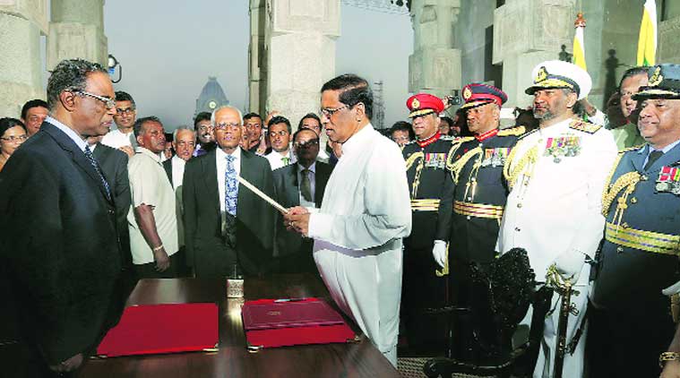 Sirisena takes oath as President in Colombo; Rajapaksa leaves the presidential residence. (Source: AP photo)