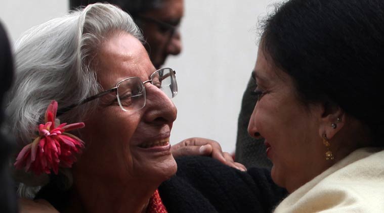 (Left) Verghese's wife at his funeral. (Source: Express Photo By Amit Mehra )