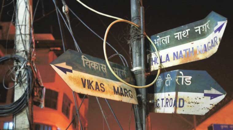 Signboards at a street crossing in East Azad Nagar; some can take you in many directions.