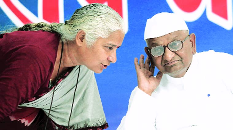 Anna with Medha Patkar on the first day of his protest at Jantar Mantar on Monday.(Source: Express Photo by Tashi Tobgyal)