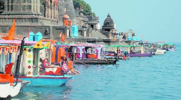 Boats with saffron flags ahead of Narmada Hindu Sangam.