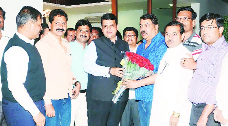 Devendra Fadnavis during his recent unscheduled visit to BJP MLA Laxman Jagtap’s residence in Gurav Pimple. He welcomed Shiv Sena’s Sarang Kamtekar to the party fold on the occasion.