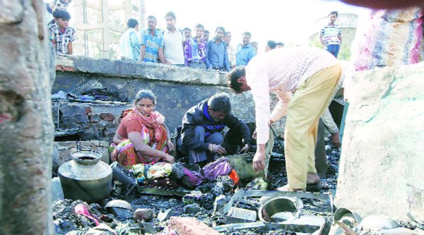 The charred hutments in the slum under the Kalupur bridge in Ahmedabad.  (Javed Raja)