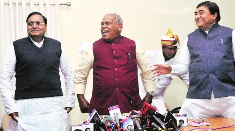 Bihar CM Jitan Ram Manjhi (centre) with Mahachandra Singh (right) and Rajiv Ranjan in Patna on Friday. (Source: Express Photo Prashant Ravi)