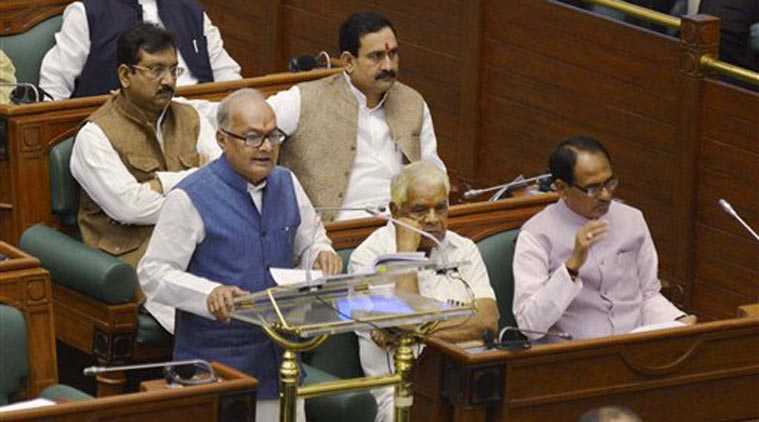  Madhya Pradesh Finance Minister Jayant Malayya presenting Budget in the Assembly in Bhopal on Wednesday. Chief Minister Shivraj Singh Chouhan is also seen in this picture. (Source: PTI) 