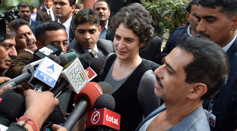 Priyanka Vadra with husband Robert Vadra address media after casting their votes for Assembly elections in New Delhi on Saturday. (Source: PTI )