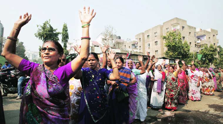 A group of women take out a rally against biometric system in ration cards in Ahmedabad. (Source: Express Photo by Javed Raja)