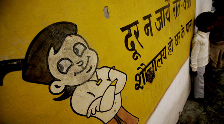 Slogans are scribbled over the walls at the primary government school in the village and the secondary school about 2 km away, on the merits of using toilets and warning children, particularly girl students, against open defecation. (Source: Express Photo by Praveen Khanna)